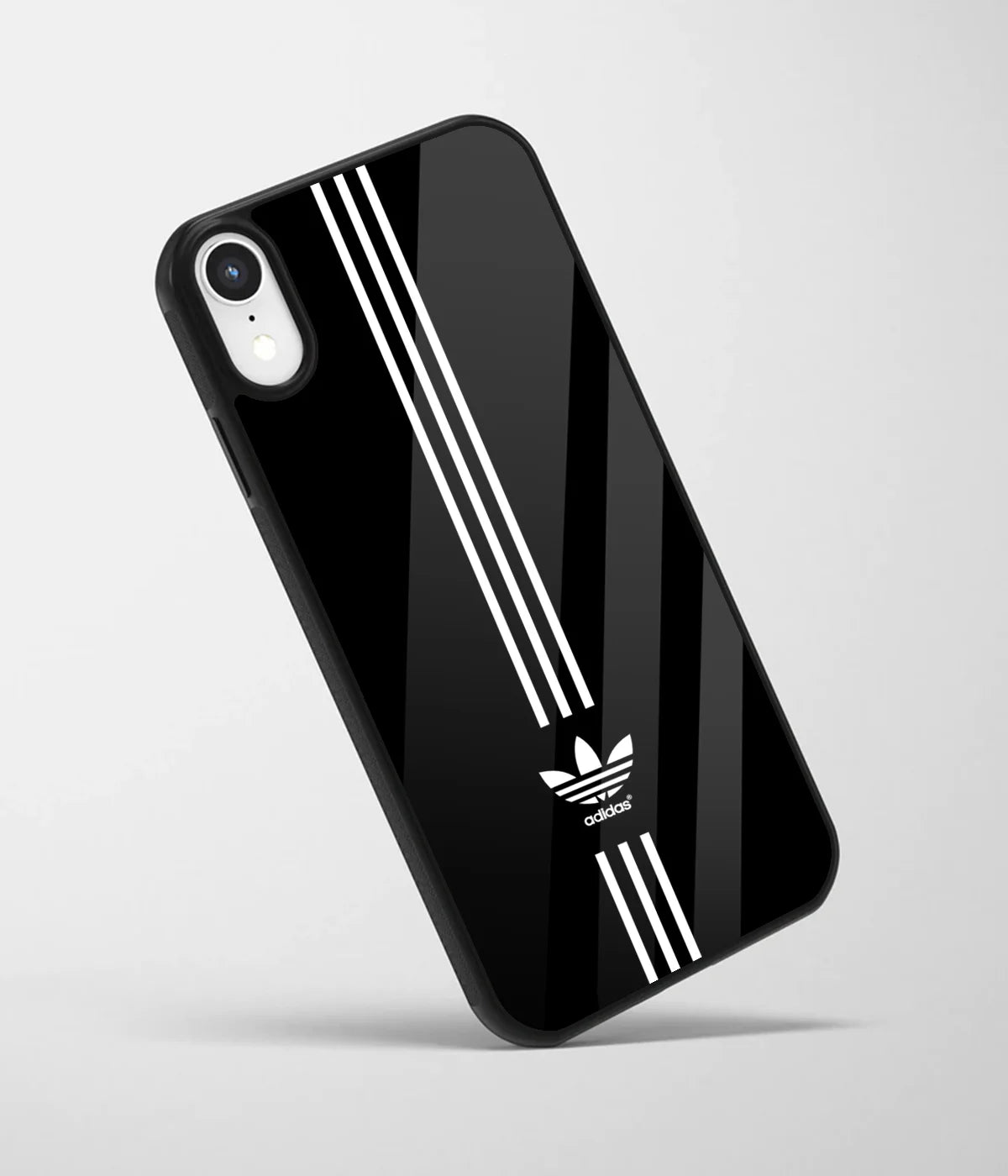 An angled view of a glass phone case featuring a vibrant design.