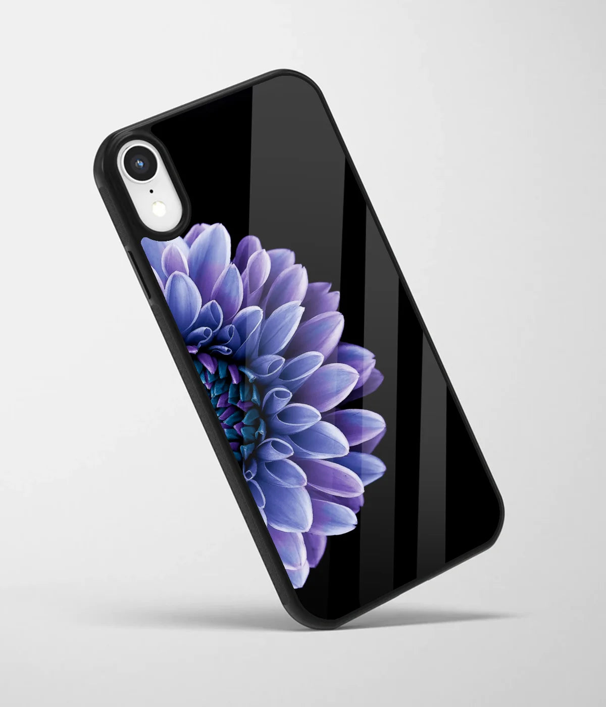An angled view of a glass phone case featuring a vibrant design.