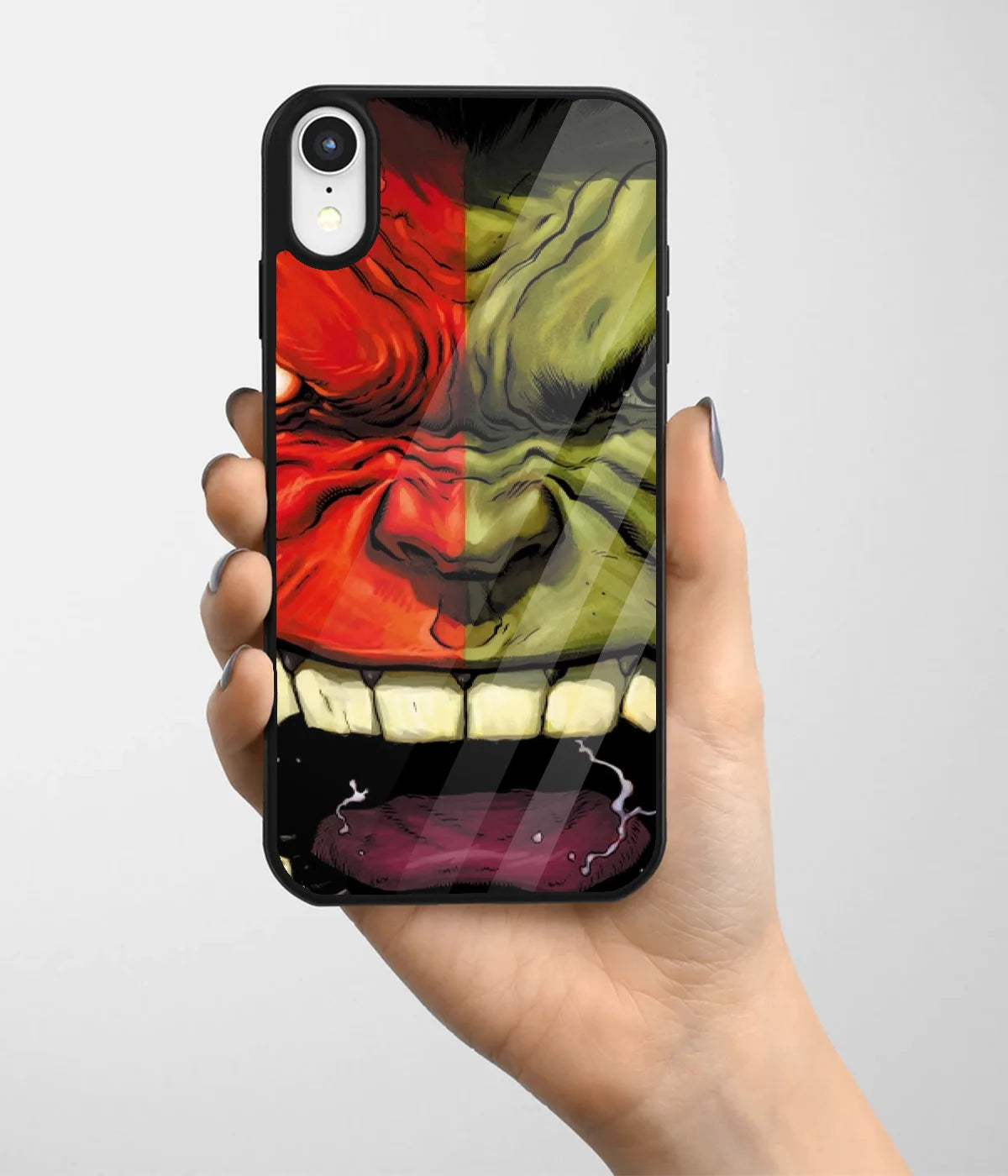A hand holding a glass phone case with a colorful design.