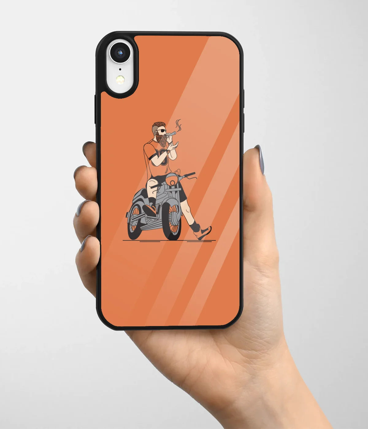 A hand holding a glass phone case with a colorful design.