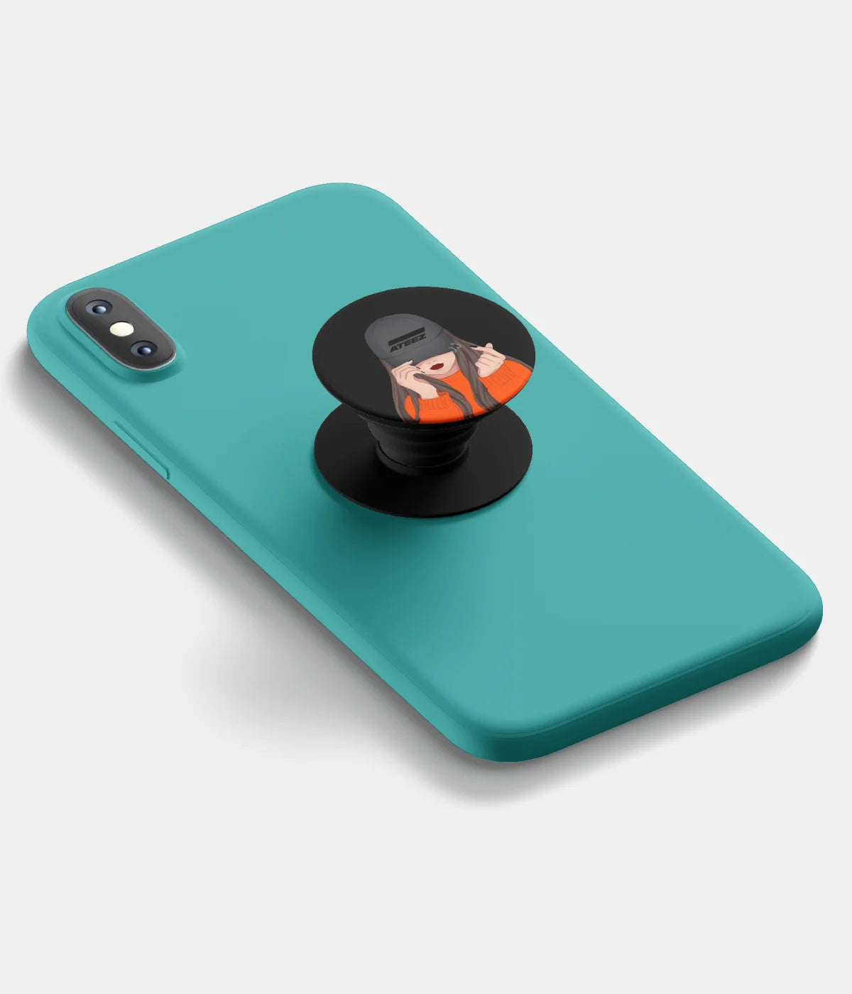 A top-down view of a phone grip holder attached to a mobile phone case on a white background