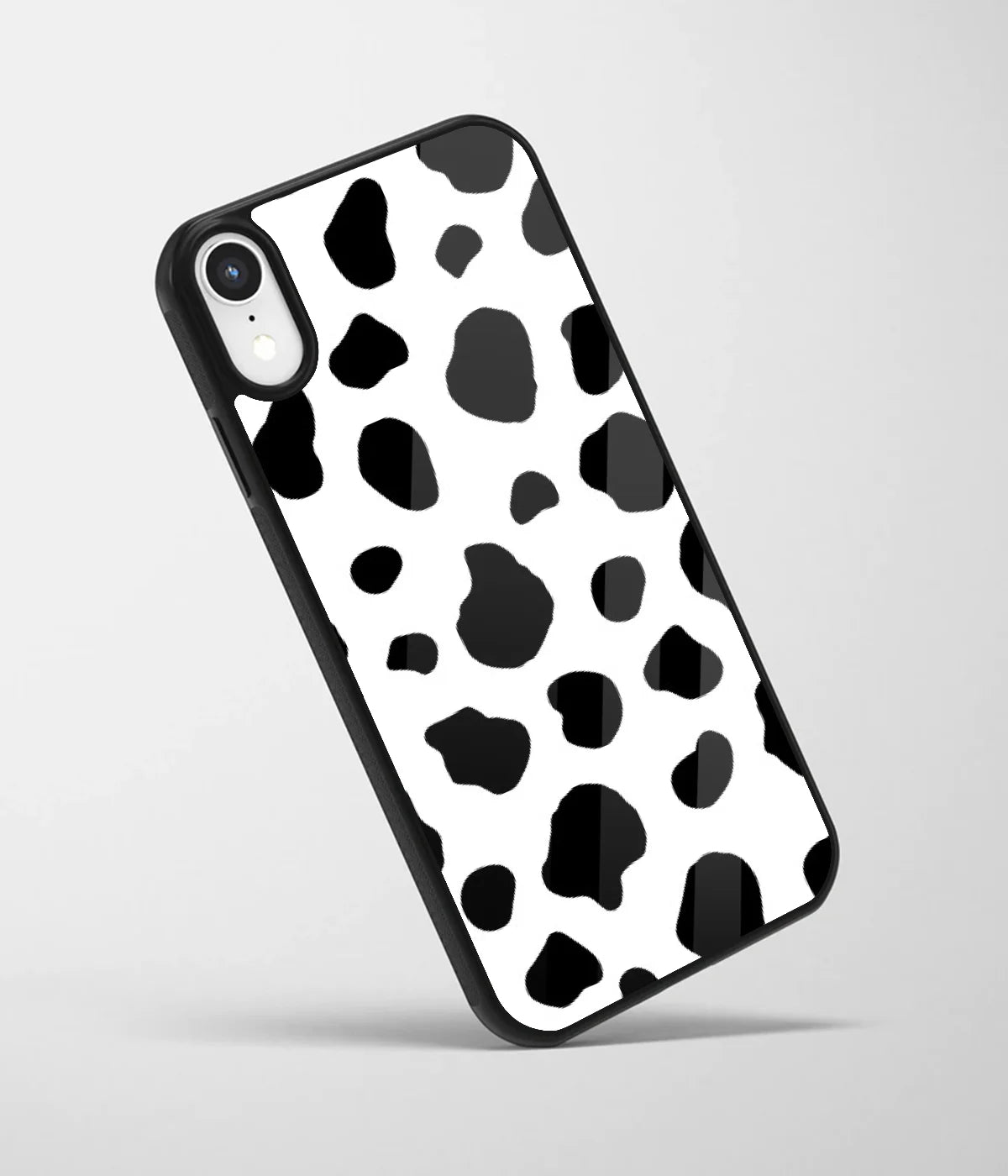 An angled view of a glass phone case featuring a vibrant design.