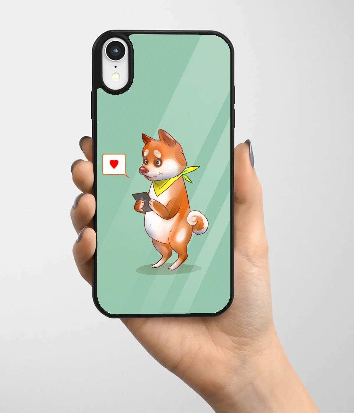 A hand holding a glass phone case with a colorful design.