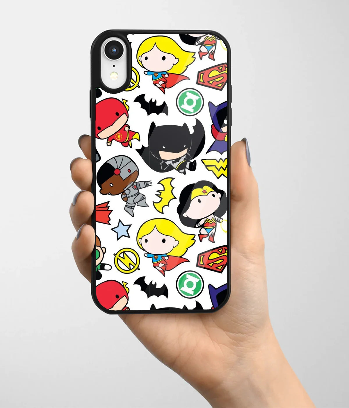 A hand holding a glass phone case with a colorful design.
