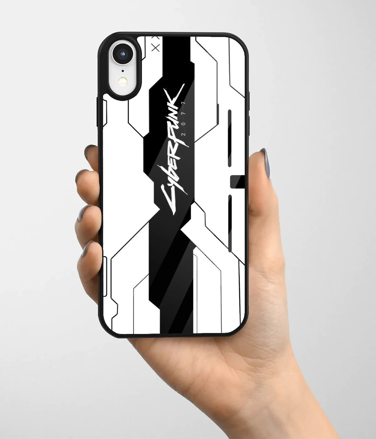 A hand holding a glass phone case with a colorful design.