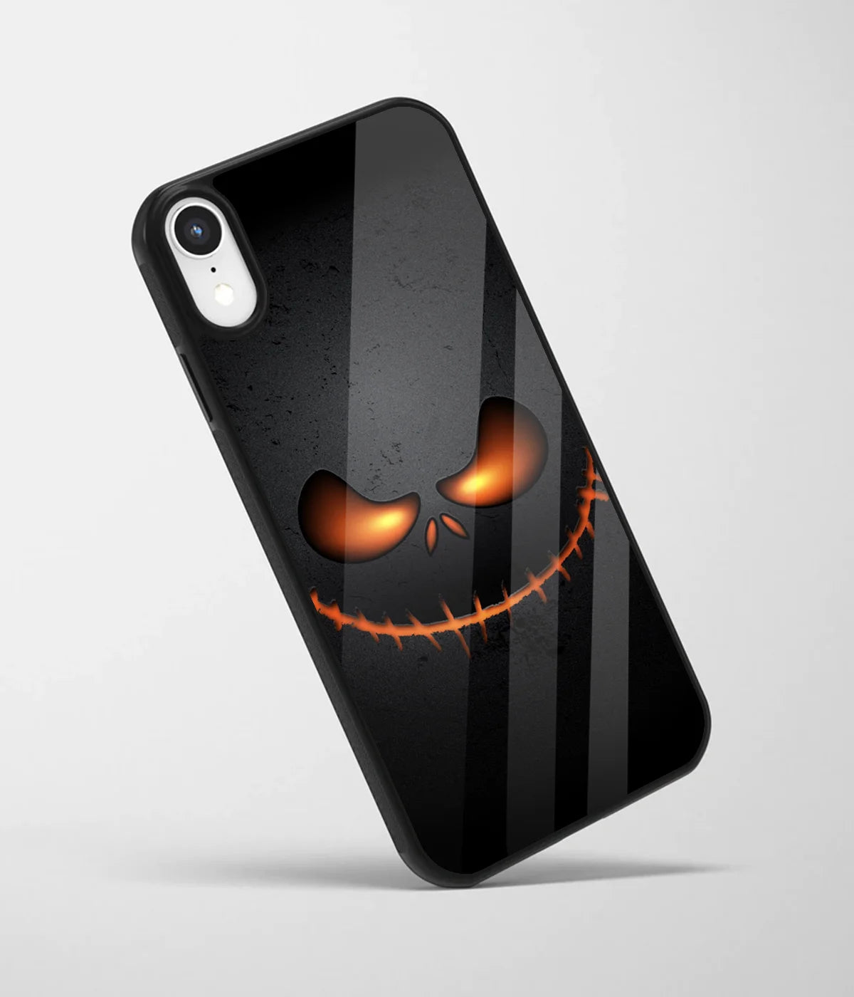 An angled view of a glass phone case featuring a vibrant design.