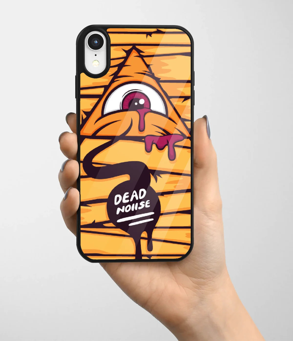 A hand holding a glass phone case with a colorful design.