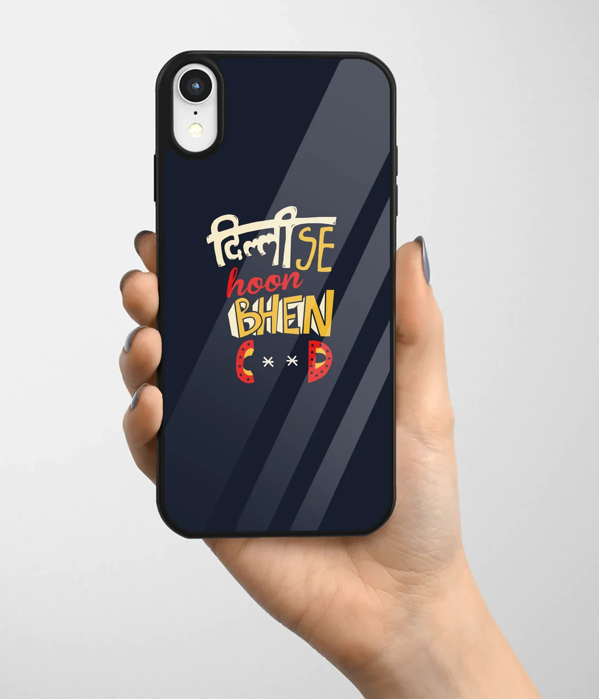 A hand holding a glass phone case with a colorful design.
