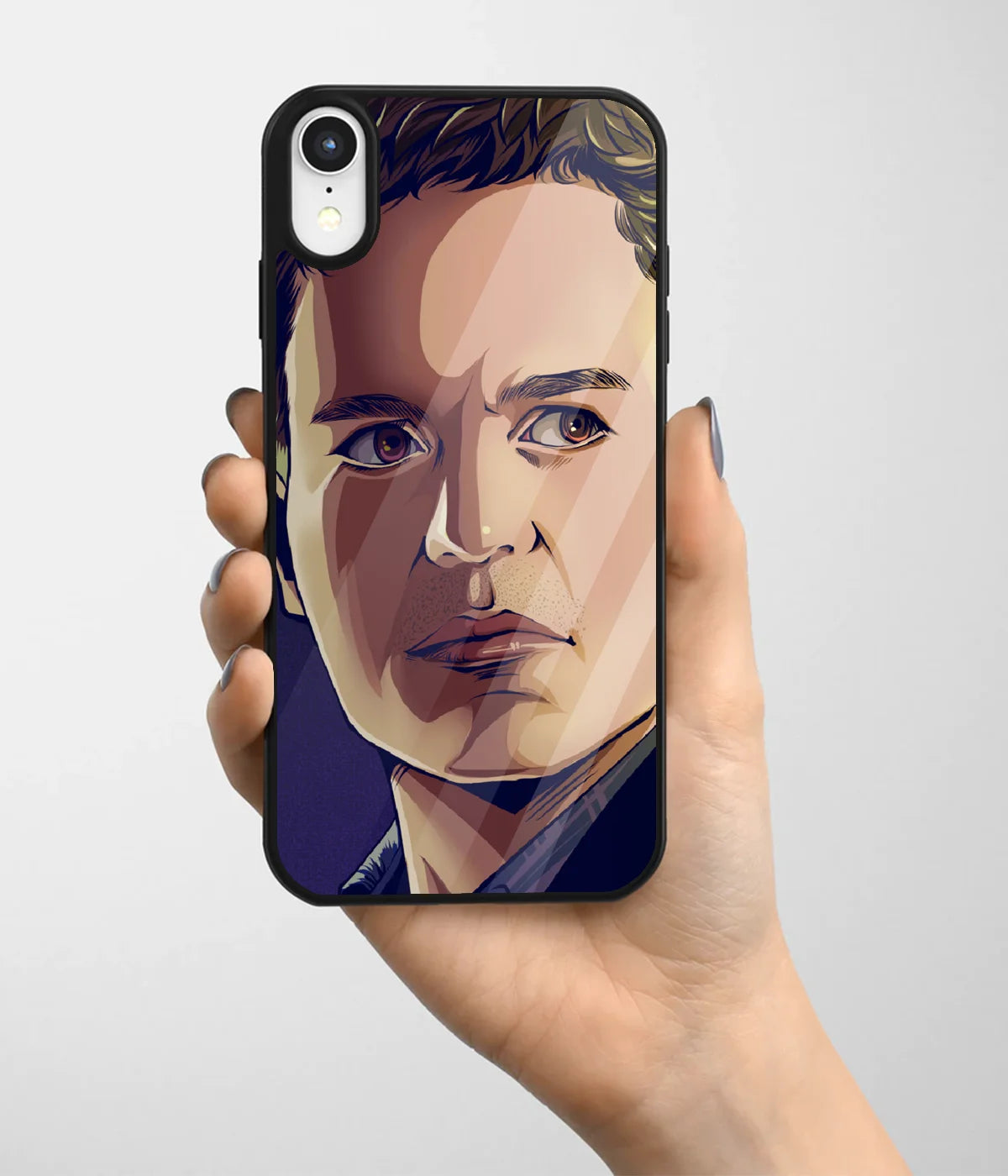 A hand holding a glass phone case with a colorful design.