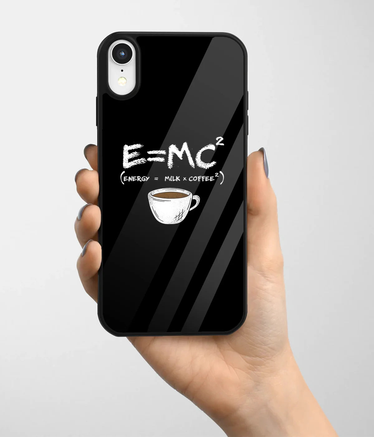 A hand holding a glass phone case with a colorful design.