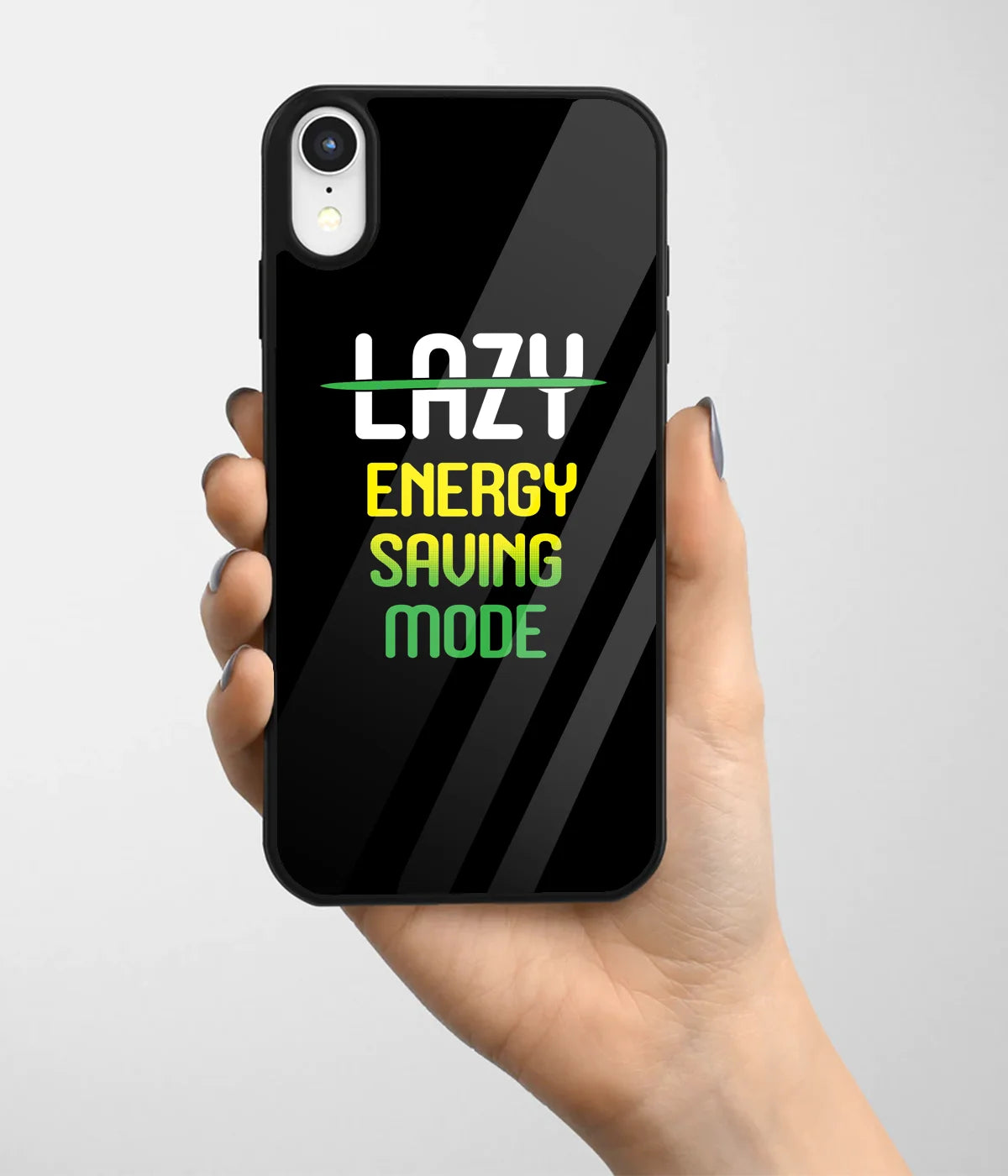 A hand holding a glass phone case with a colorful design.