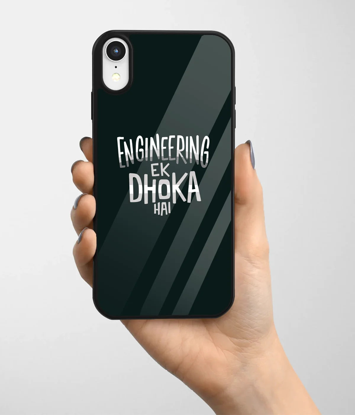 A hand holding a glass phone case with a colorful design.