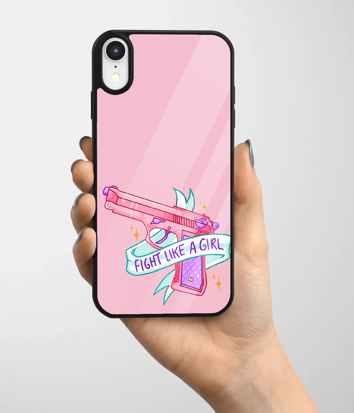 A hand holding a glass phone case with a colorful design.