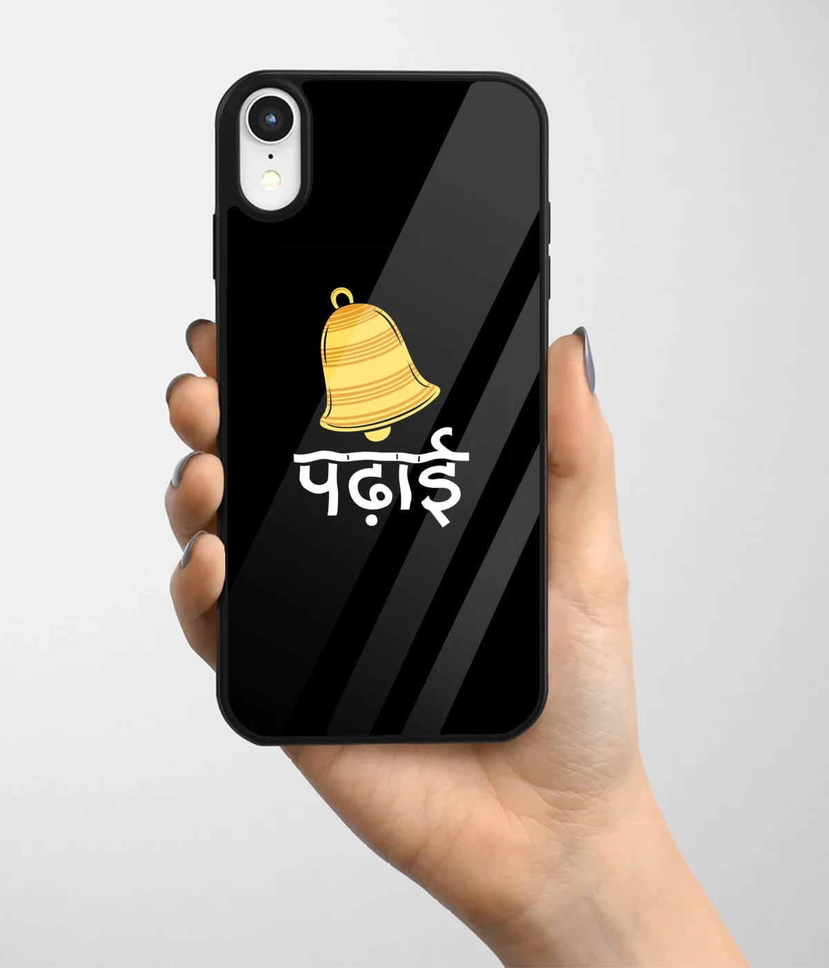 A hand holding a glass phone case with a colorful design.