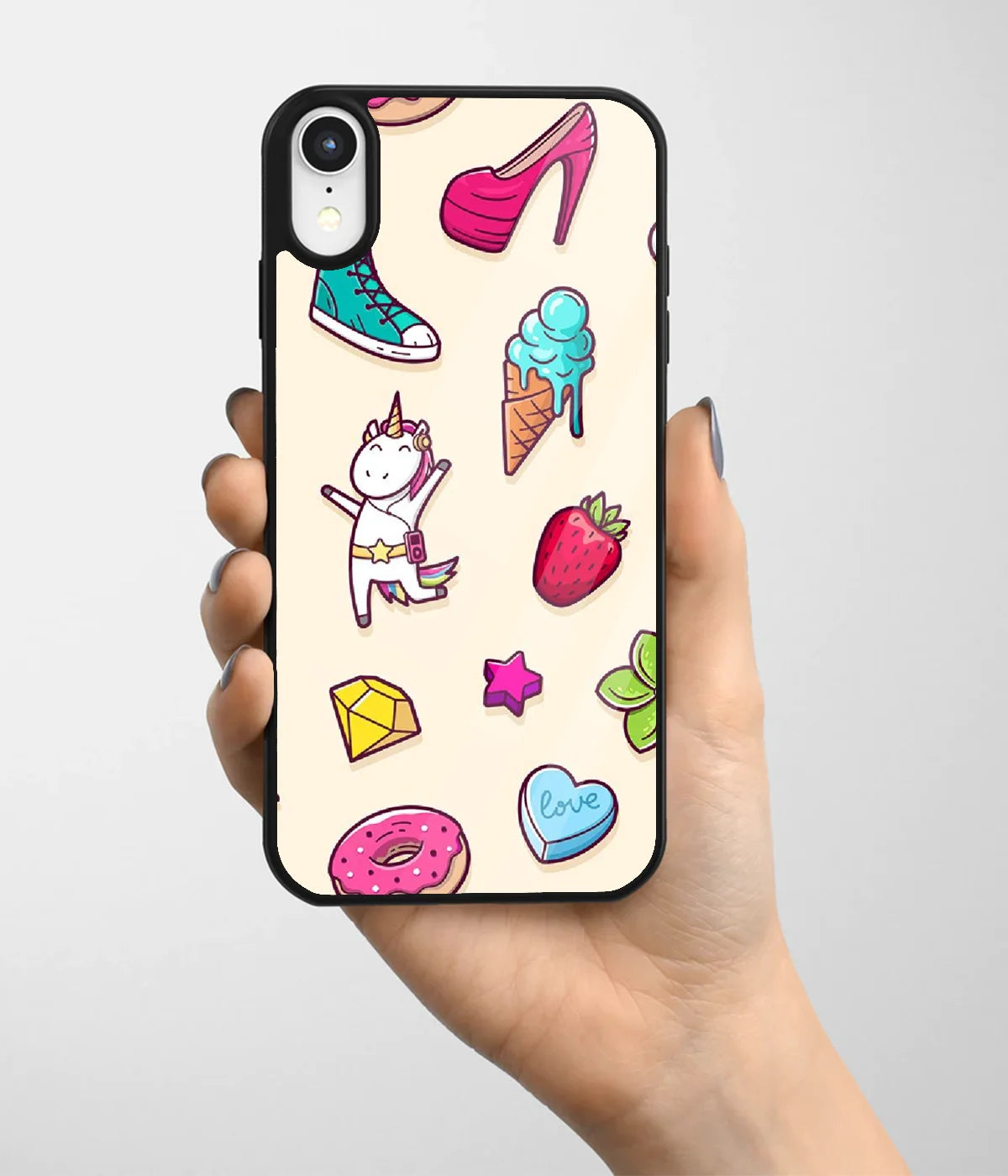A hand holding a glass phone case with a colorful design.