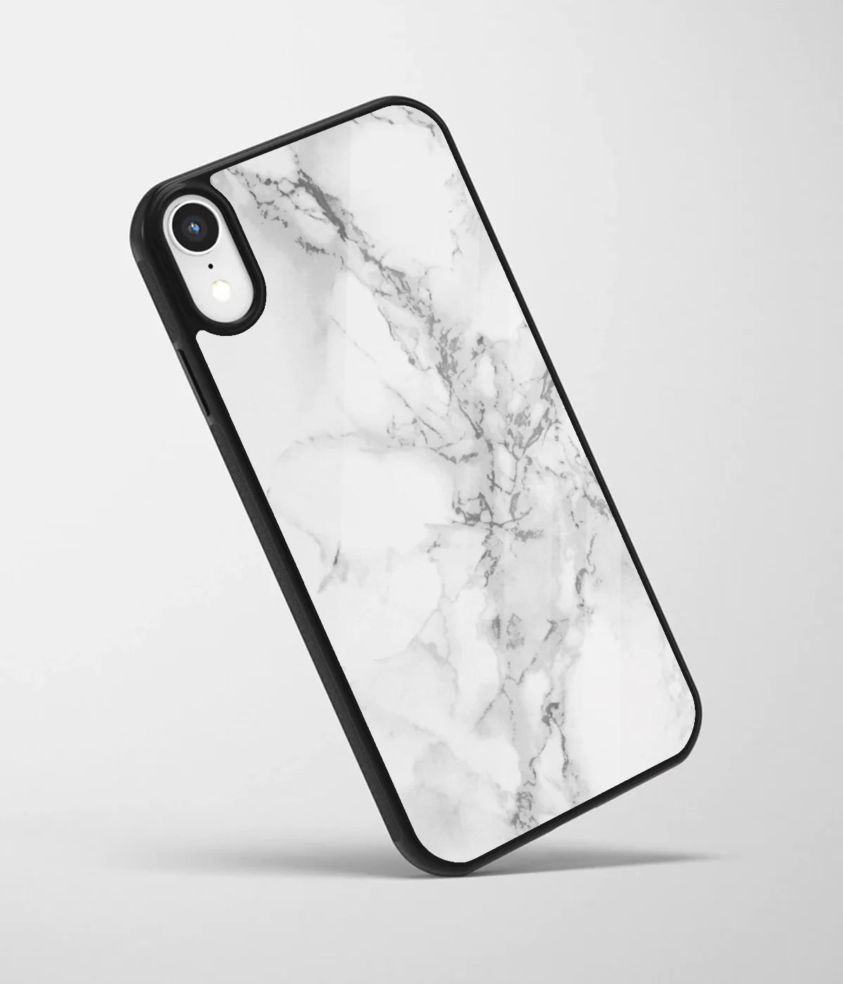 An angled view of a glass phone case featuring a vibrant design.