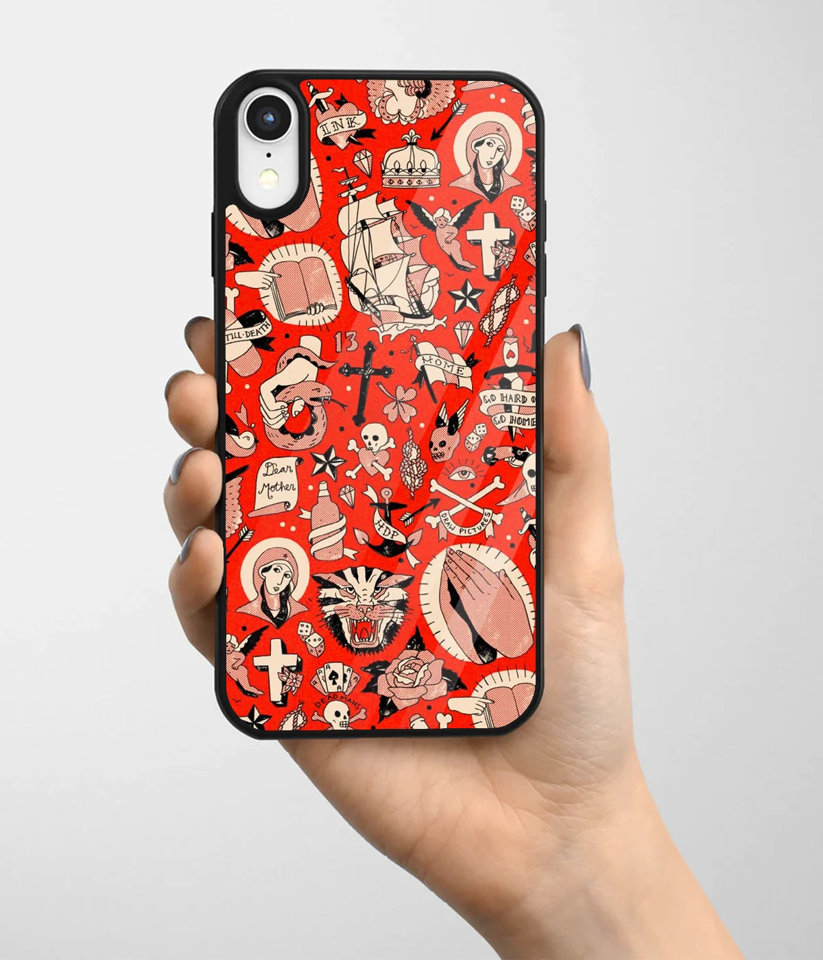 A hand holding a glass phone case with a colorful design.