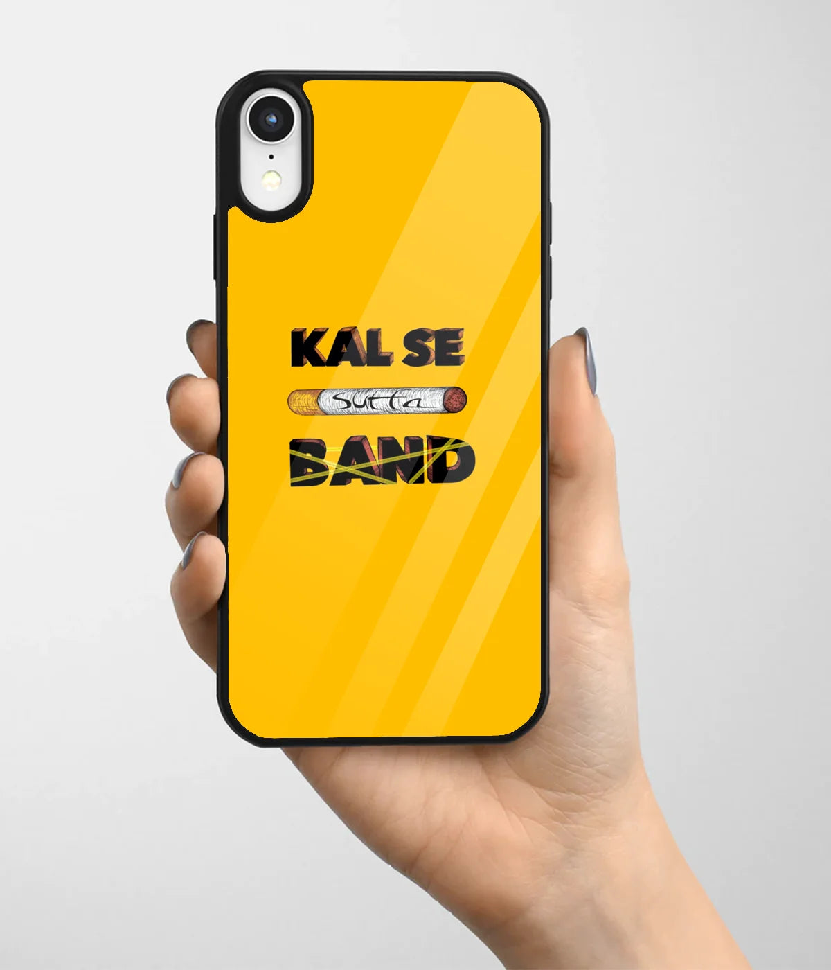 A hand holding a glass phone case with a colorful design.