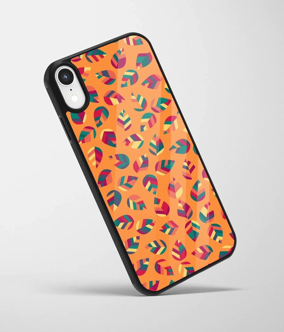 An angled view of a glass phone case featuring a vibrant design.