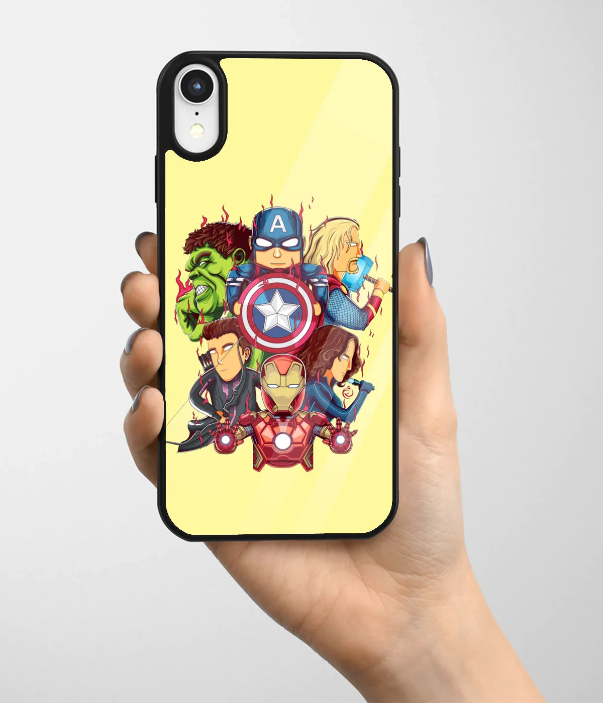 A hand holding a glass phone case with a colorful design.