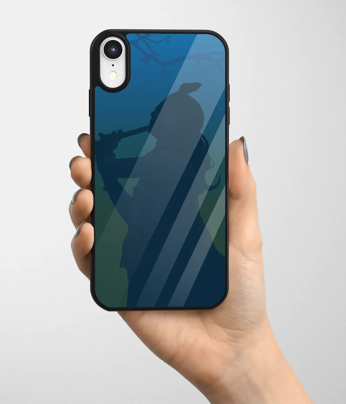 A hand holding a glass phone case with a colorful design.