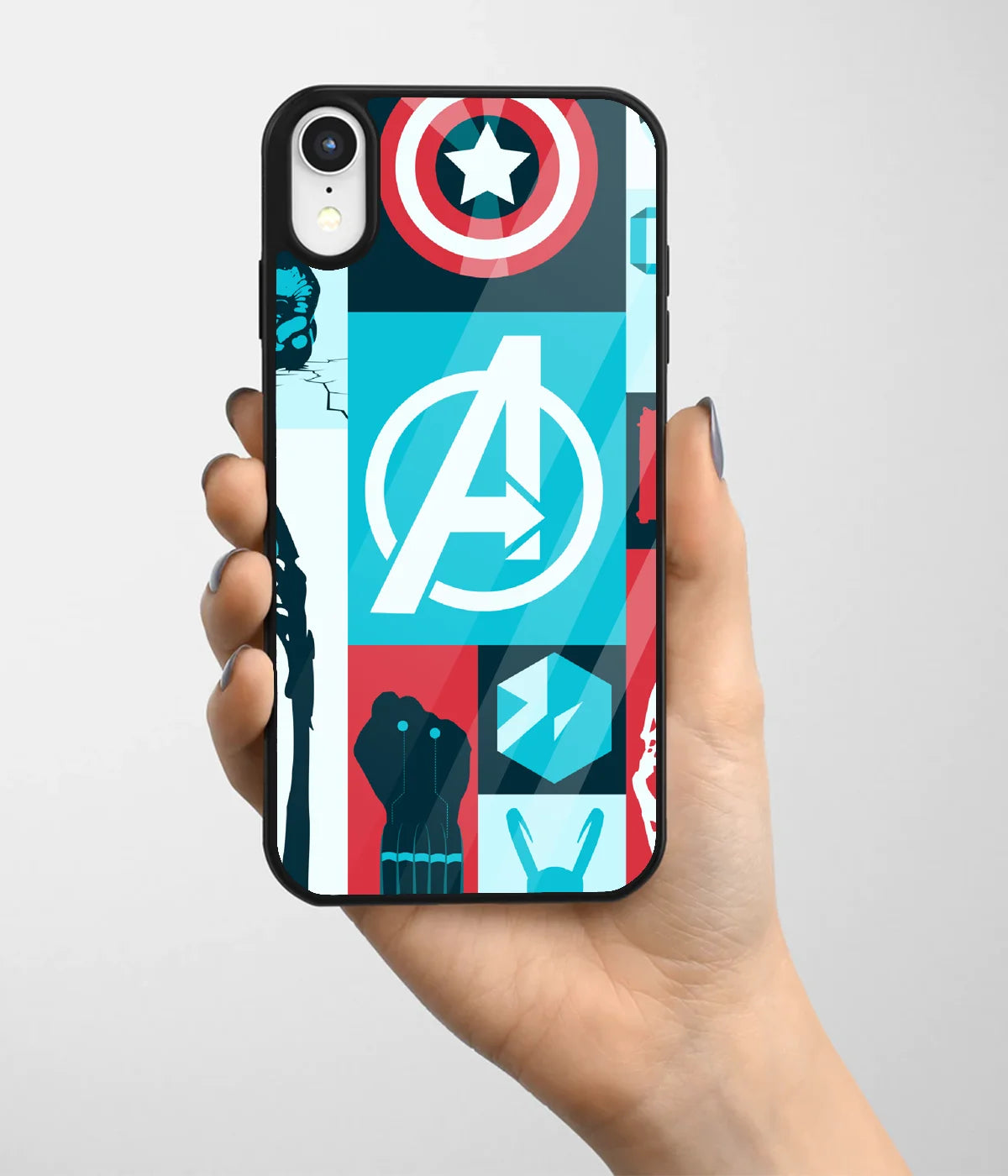 A hand holding a glass phone case with a colorful design.