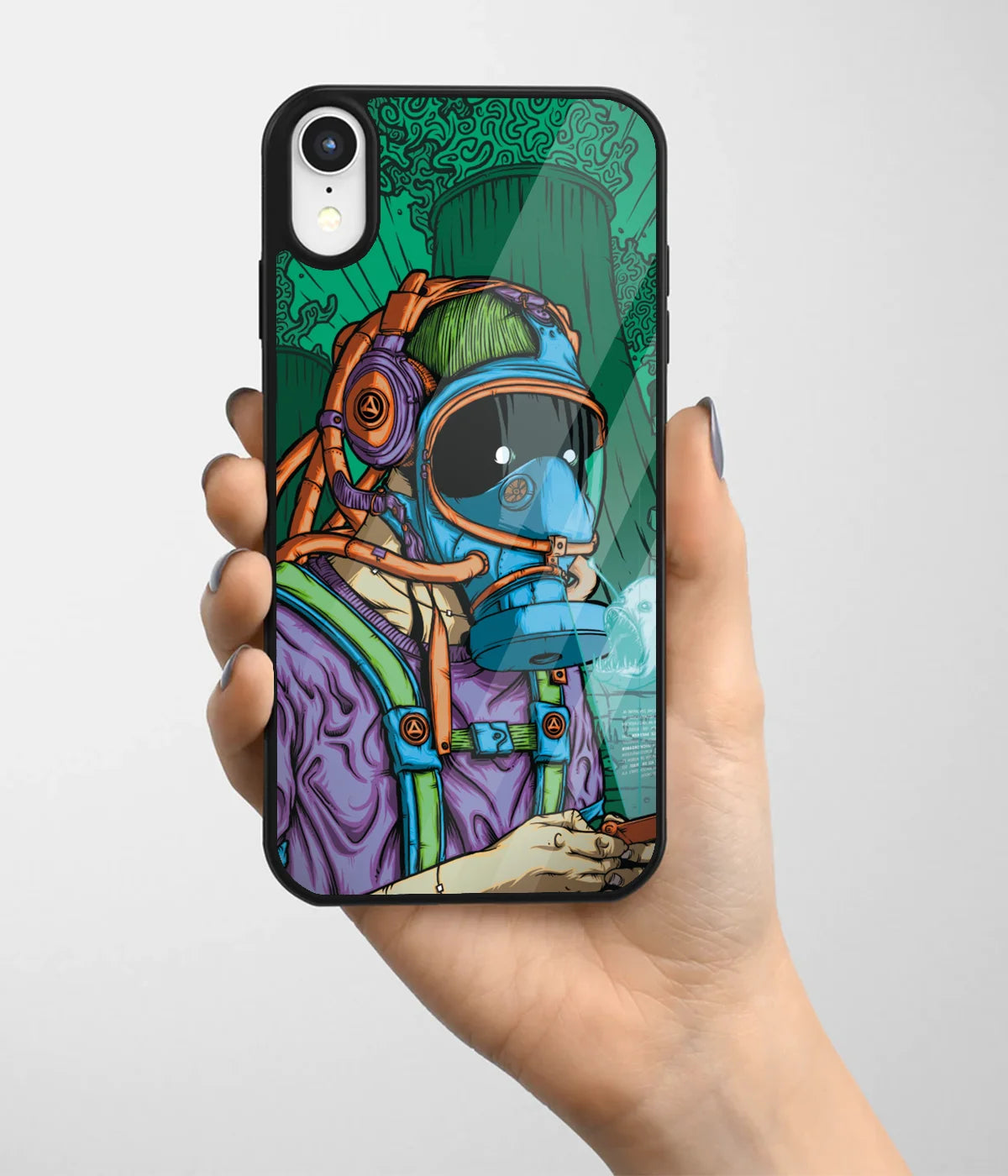 A hand holding a glass phone case with a colorful design.