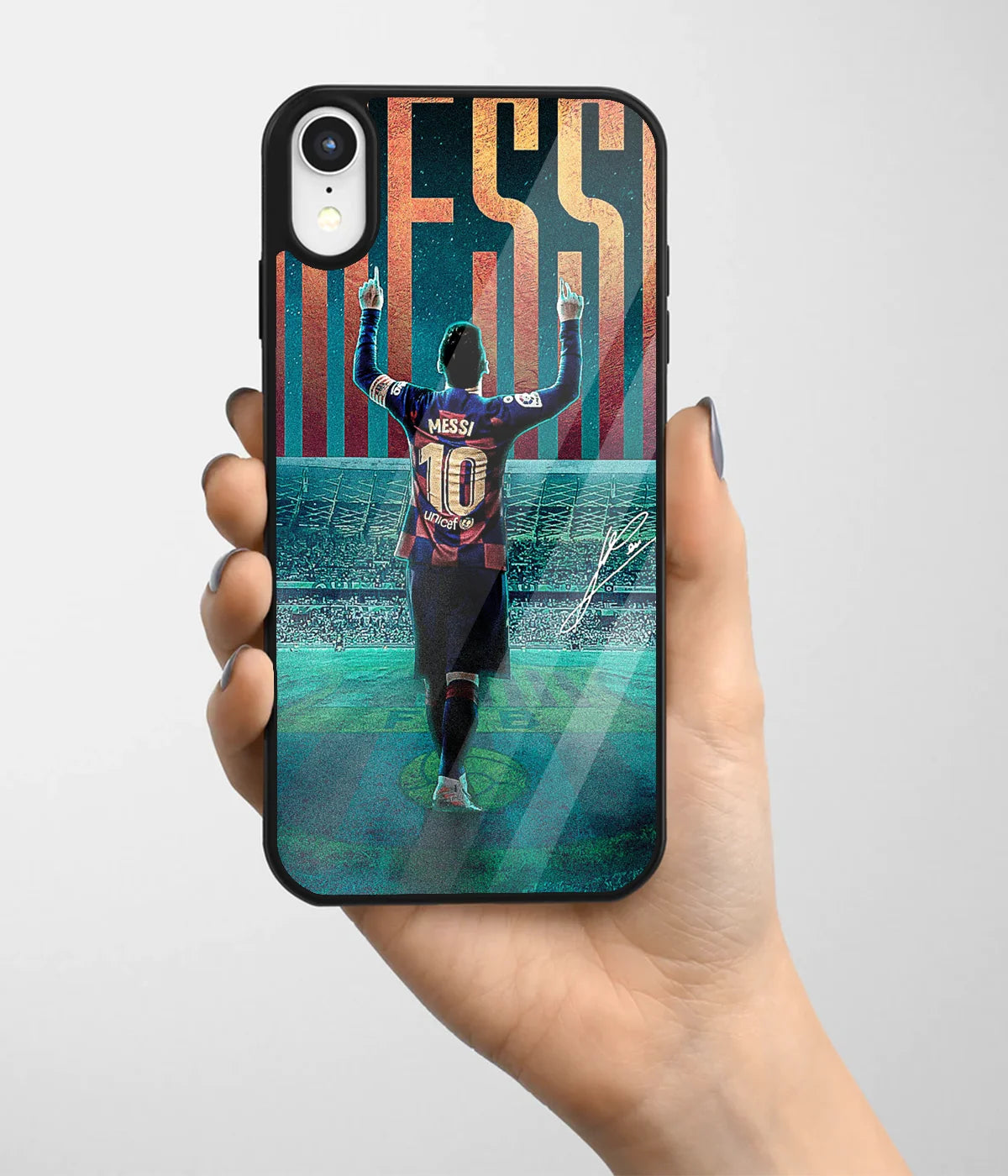 A hand holding a glass phone case with a colorful design.