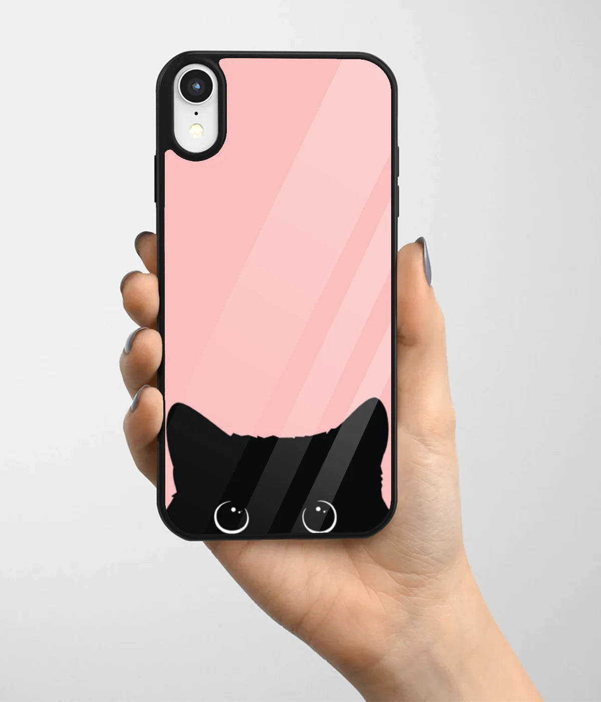 A hand holding a glass phone case with a colorful design.
