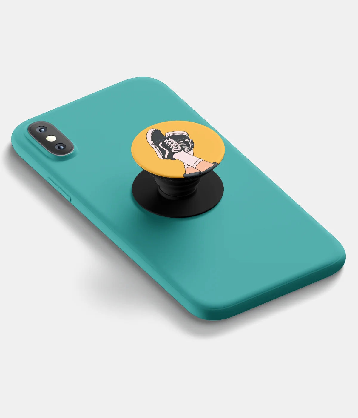 A top-down view of a phone grip holder attached to a mobile phone case on a white background
