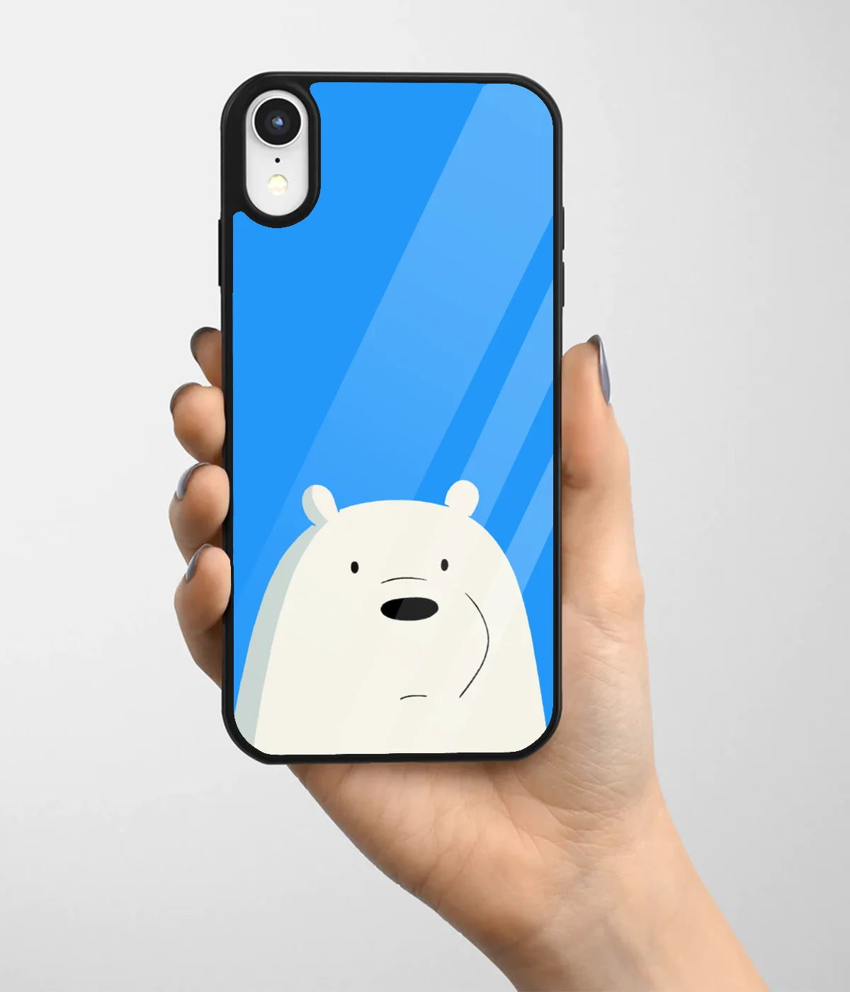 A hand holding a glass phone case with a colorful design.