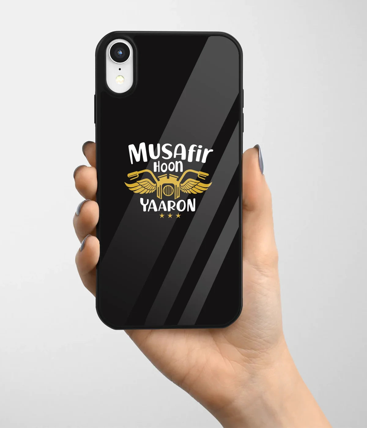 A hand holding a glass phone case with a colorful design.