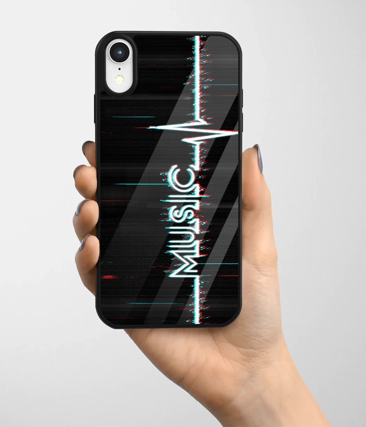 A hand holding a glass phone case with a colorful design.