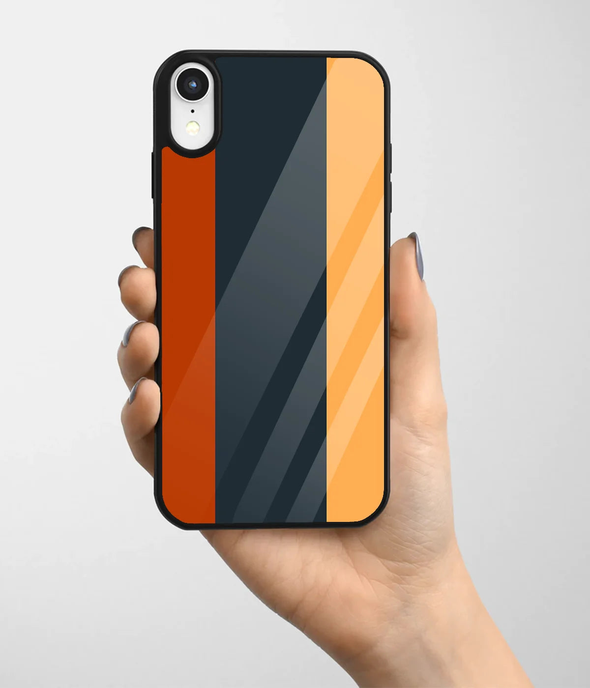 A hand holding a glass phone case with a colorful design.