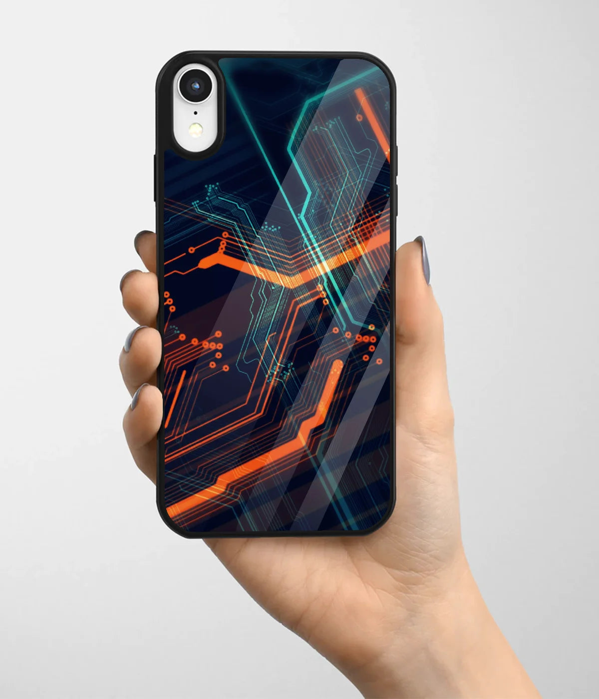 A hand holding a glass phone case with a colorful design.