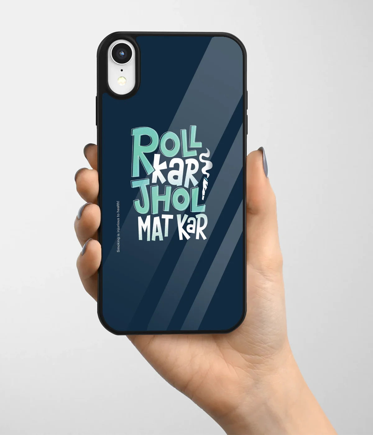 A hand holding a glass phone case with a colorful design.