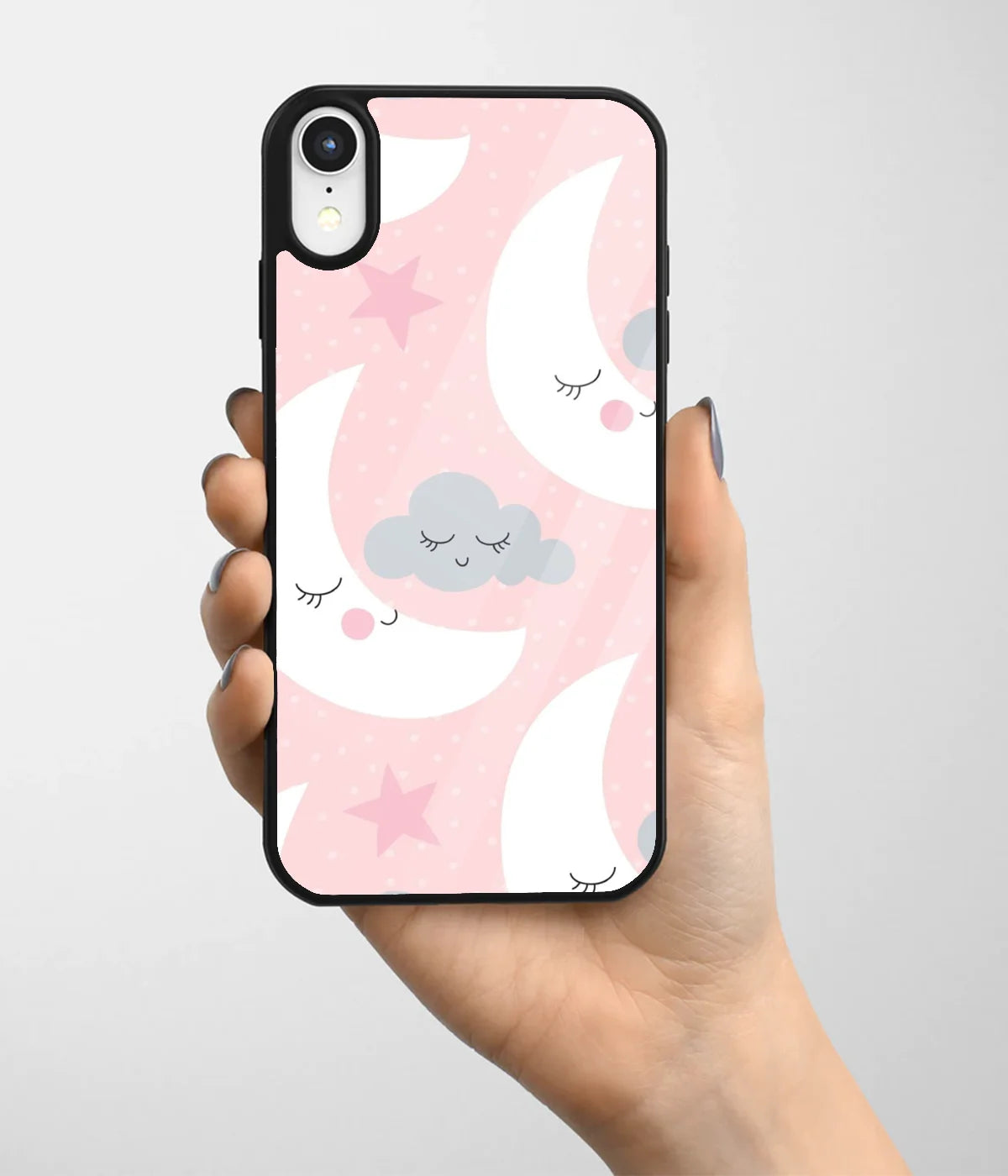 A hand holding a glass phone case with a colorful design.