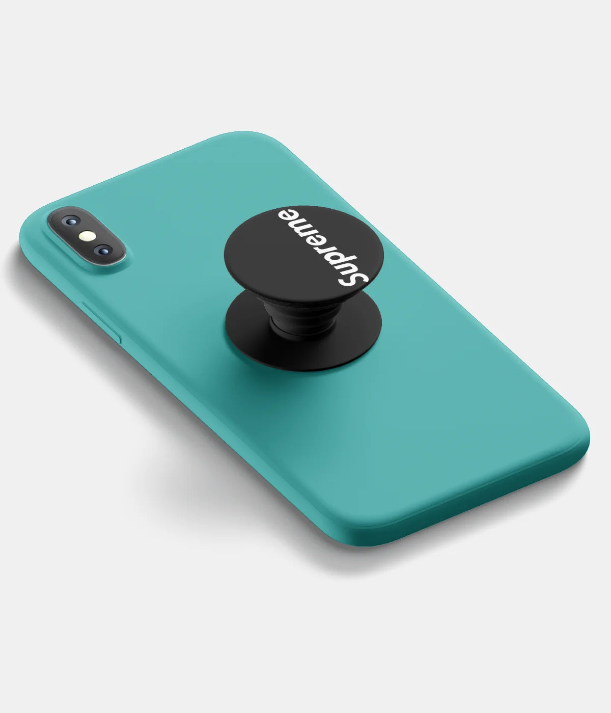 A top-down view of a phone grip holder attached to a mobile phone case on a white background