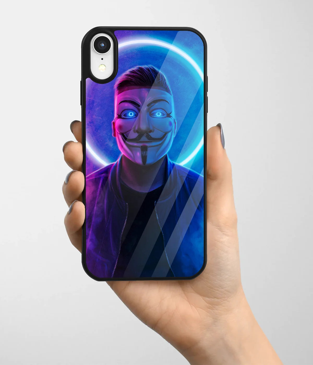 A hand holding a glass phone case with a colorful design.