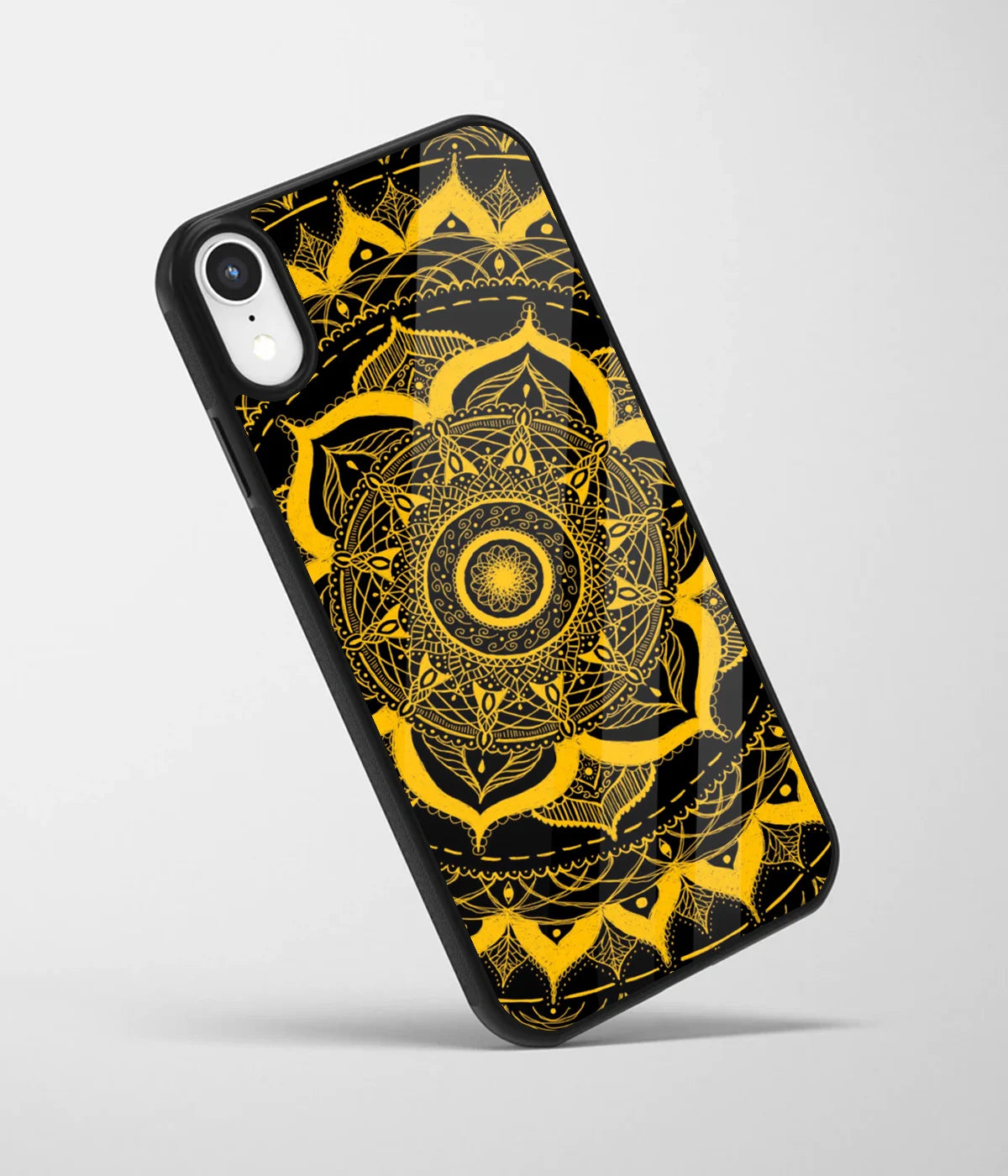 An angled view of a glass phone case featuring a vibrant design.