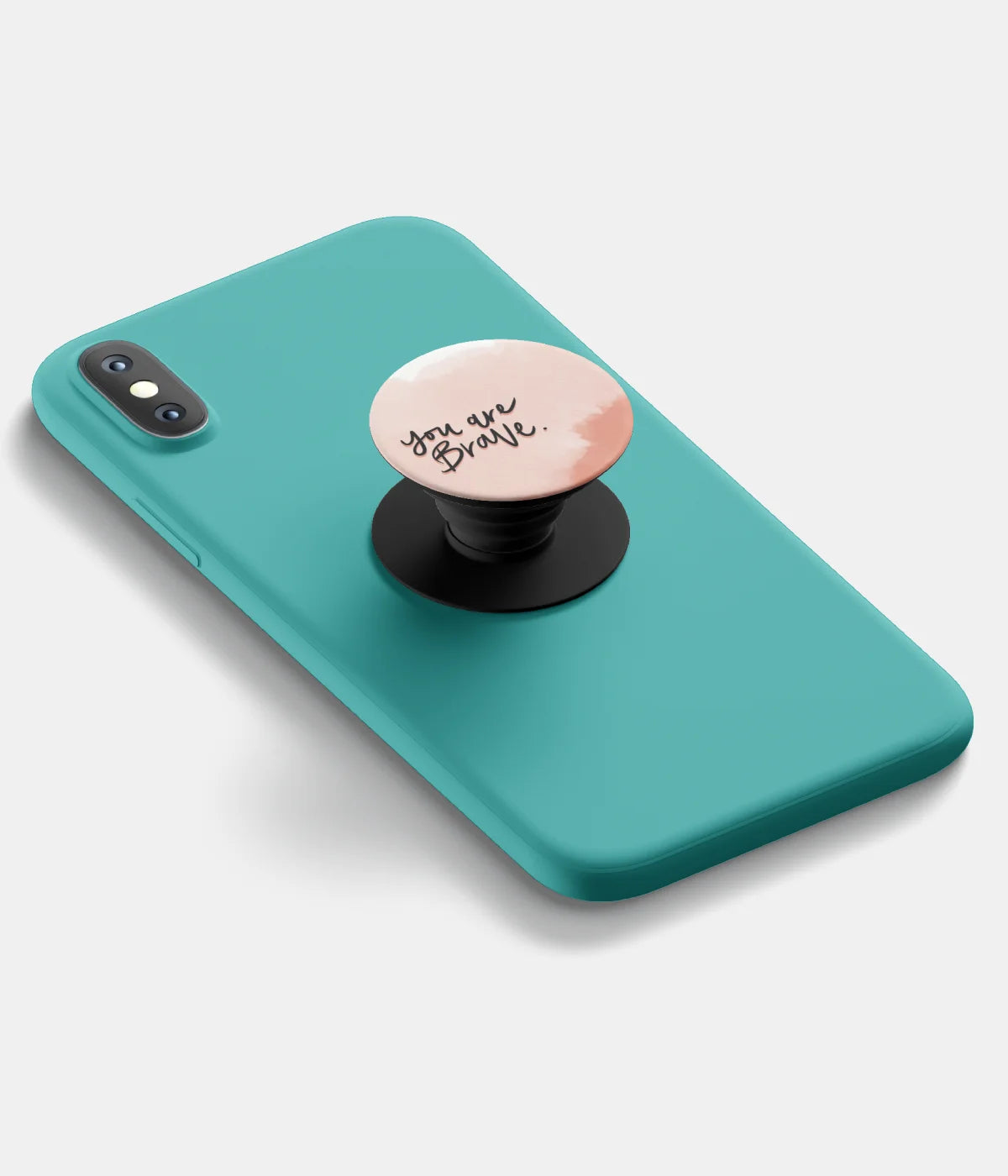 A top-down view of a phone grip holder attached to a mobile phone case on a white background