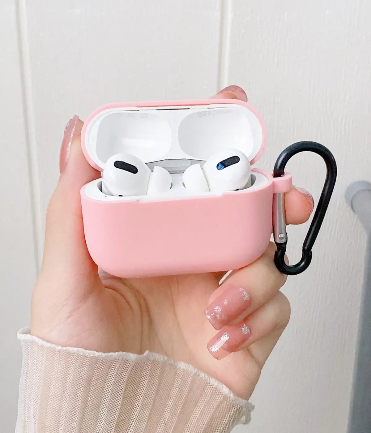 A Cameo Pink liquid silicone case for the Airpods.