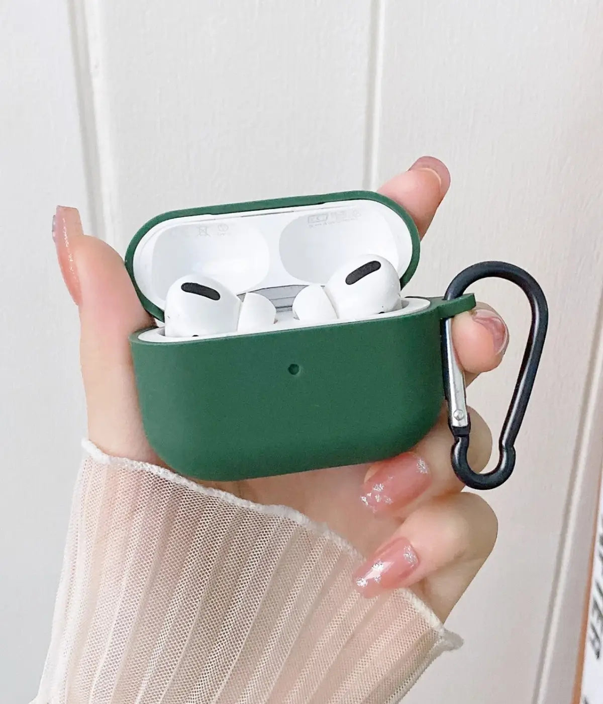 A Cyprus Green liquid silicone case for the Airpods.