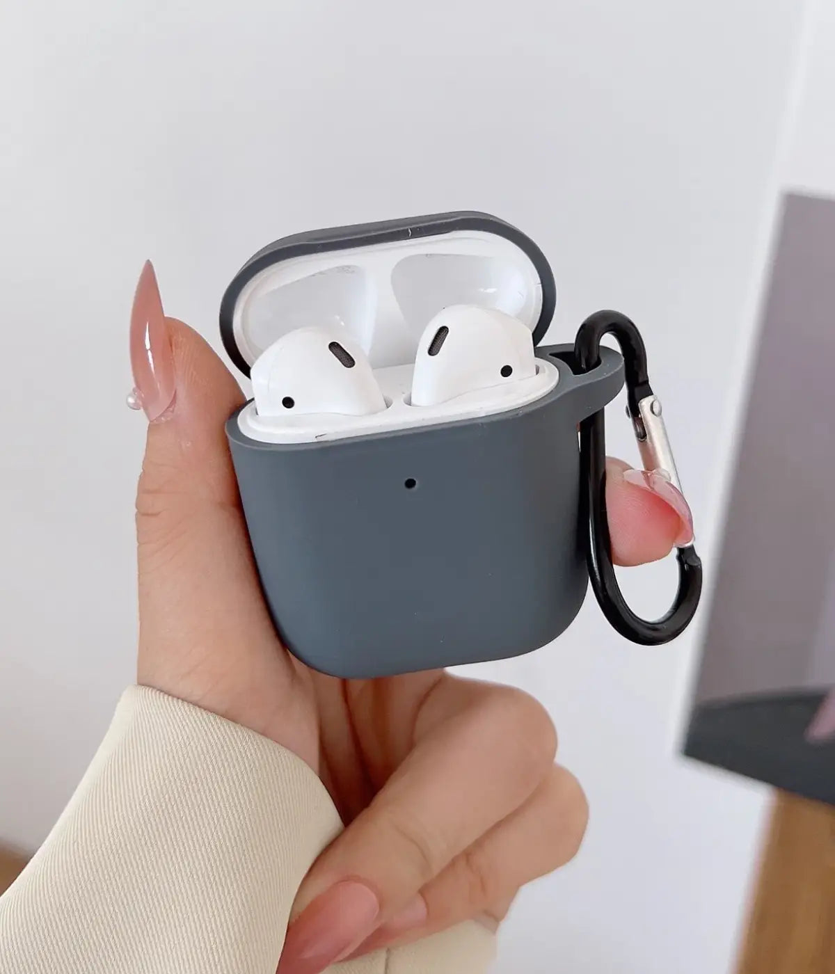 A Dark Grey liquid silicone case for the Airpods.