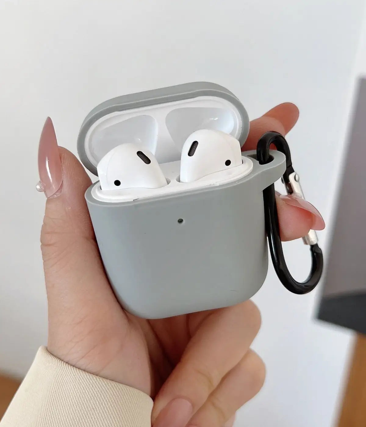 A Light Grey liquid silicone case for the Airpods.