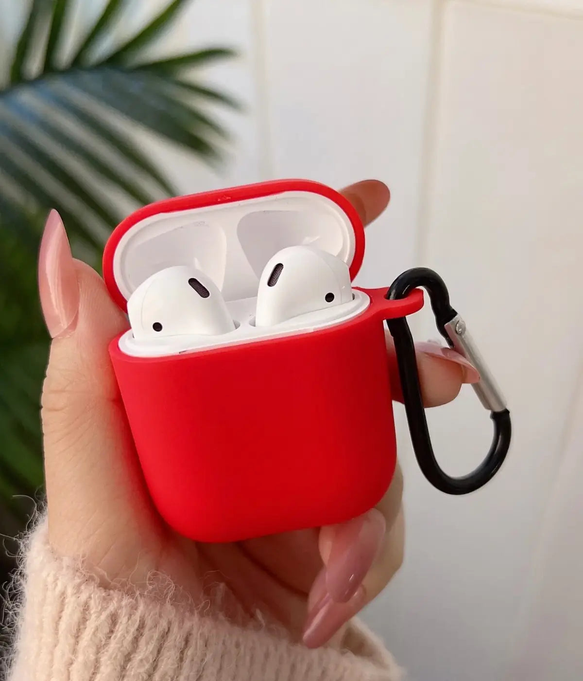 A Red liquid silicone case for the Airpods.