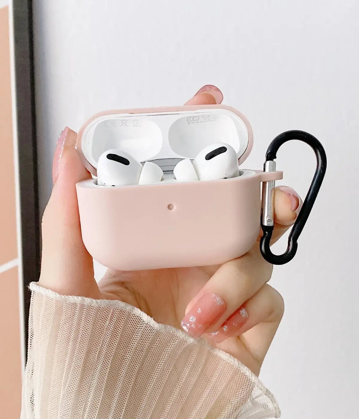 A Sand Pink liquid silicone case for the Airpods.