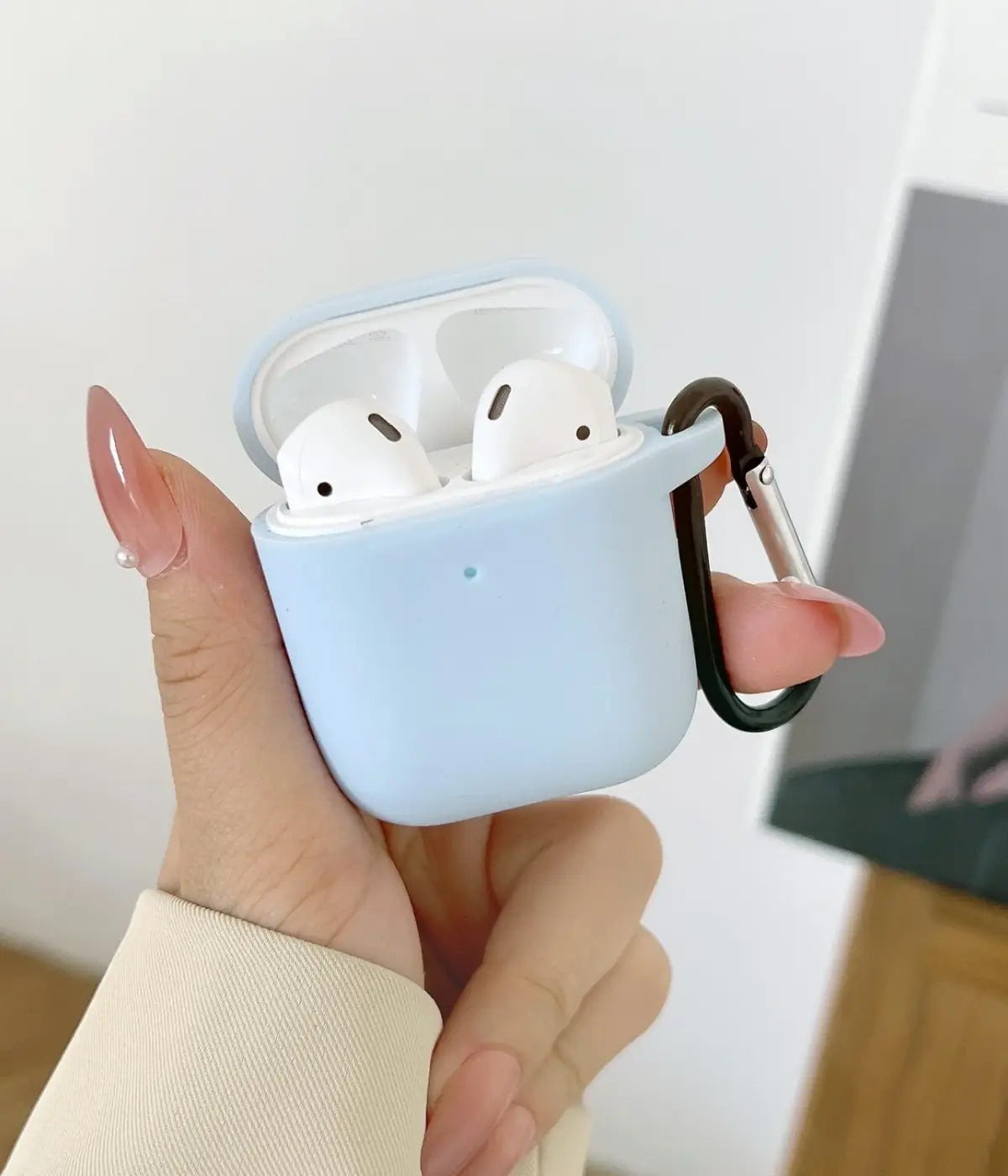 A Sky Blue liquid silicone case for the Airpods.