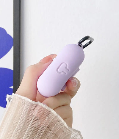 Close-up of a Lilac liquid silicone protective case for Apple AirPods held in a hand