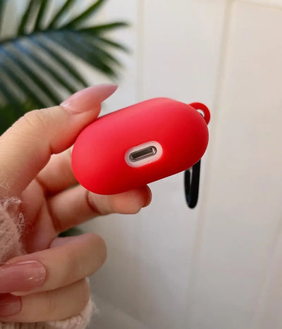 Close-up of a Red liquid silicone protective case for Apple AirPods held in a hand